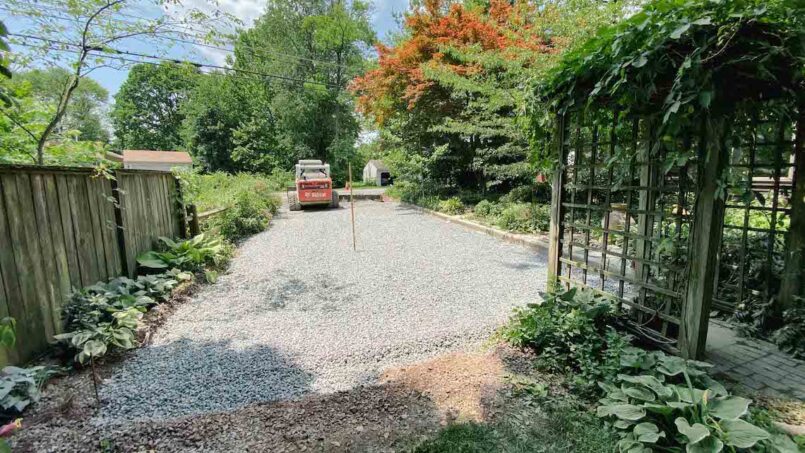 Stone is added on top of the driveway