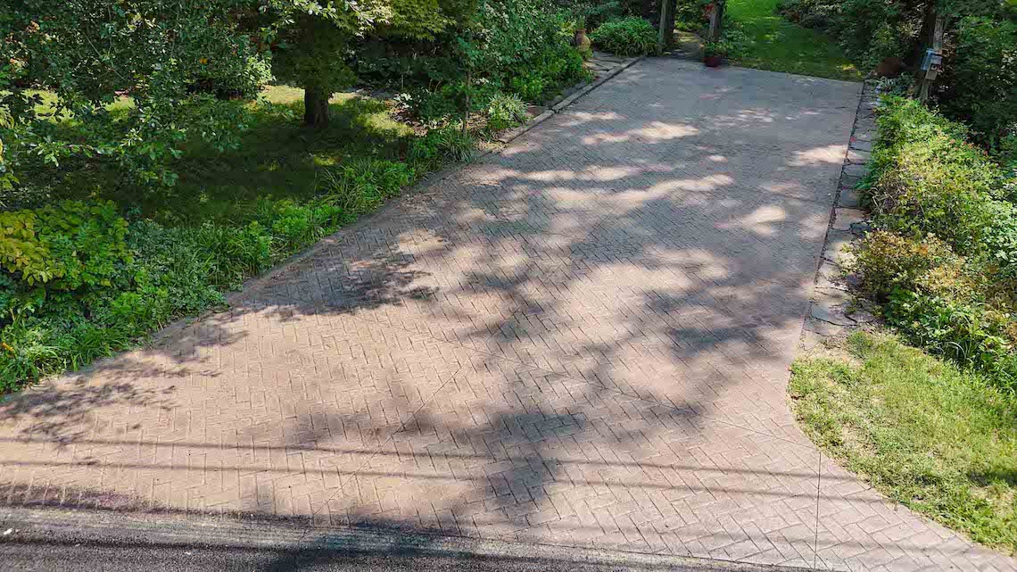 The stamped concrete driveway is complete