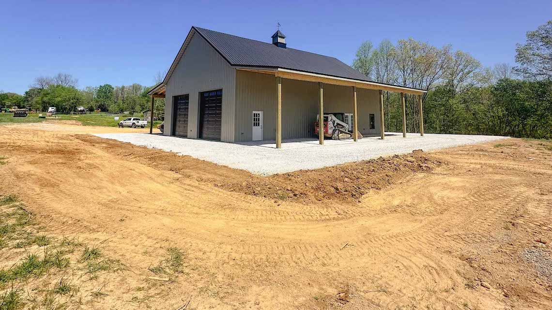 Grading and stone preparation at a BedRock barndominium foundation project in Nunnelly, Tennessee