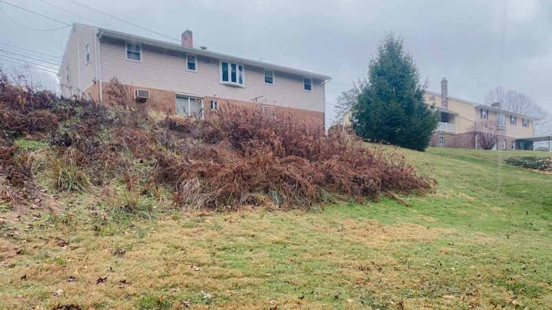 Two-Tiered Rosetta Grand Ledge Retaining Wall 1 The steep grade in this backyard