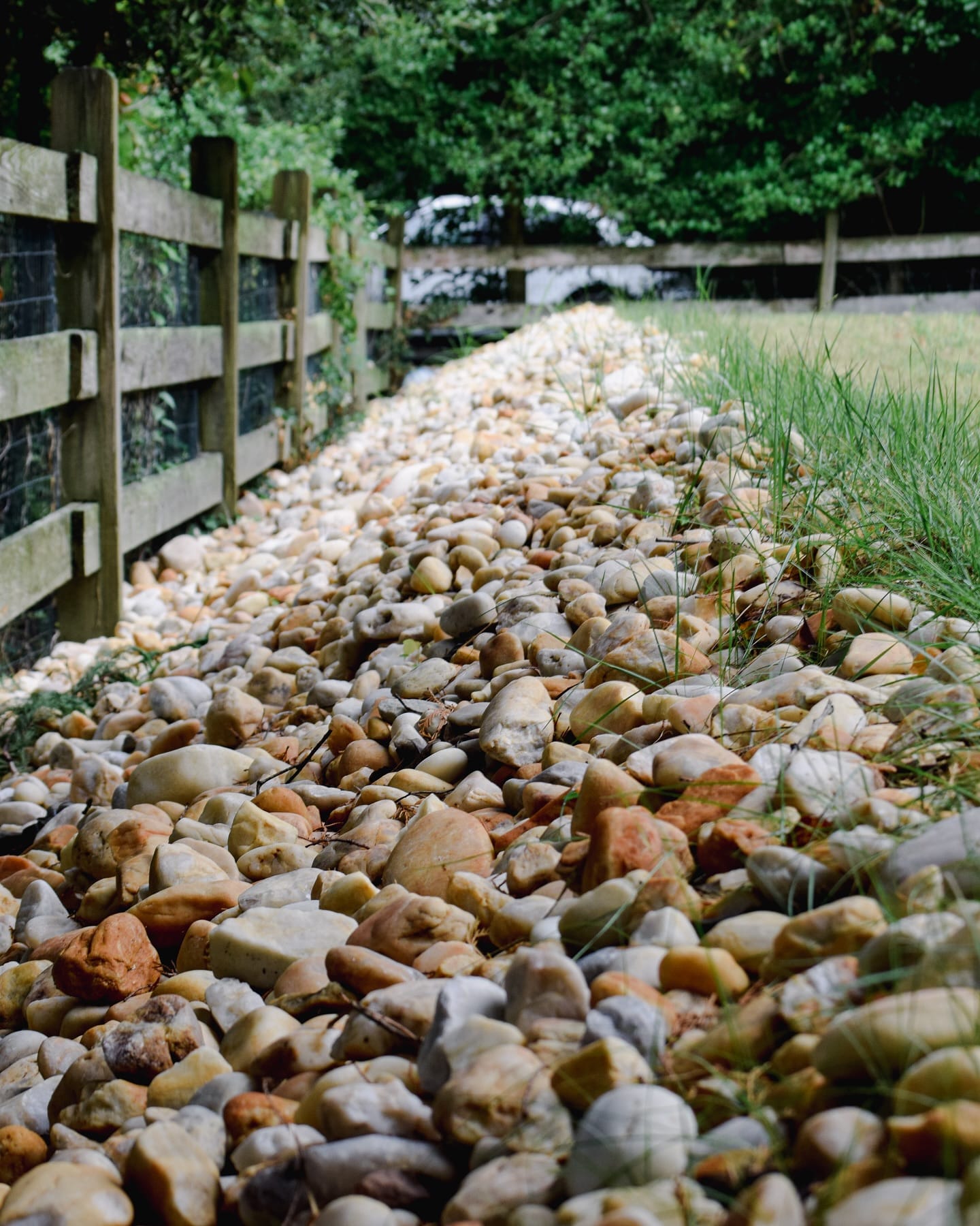 Textured photo with multicolored stone for yard drainage
