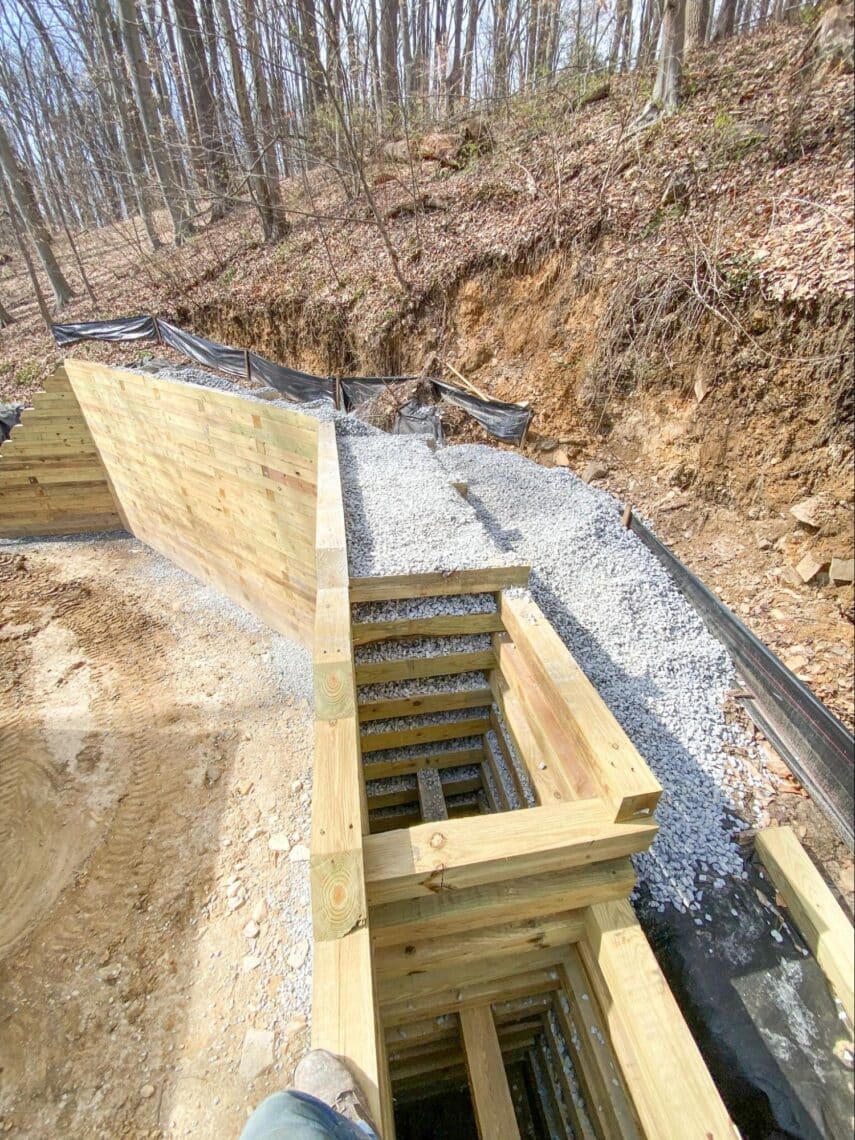 Build process photo of BedRock Siteworks' Timber Retaining Wall.